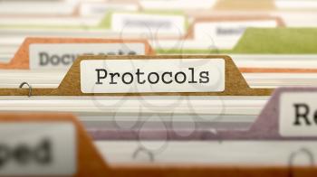 Protocols Concept on Folder Register in Multicolor Card Index. Closeup View. Selective Focus.