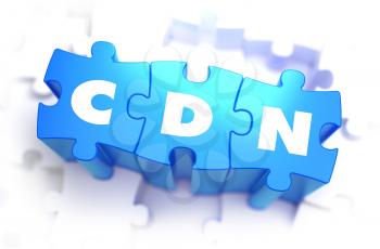 CDN - Content Delivery Distribution - White Word on Blue Puzzles on White Background. 3D Illustration.