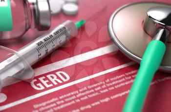 GERD - Printed Diagnosis on Red Background and Medical Composition - Stethoscope, Pills and Syringe. Medical Concept. Blurred Image.