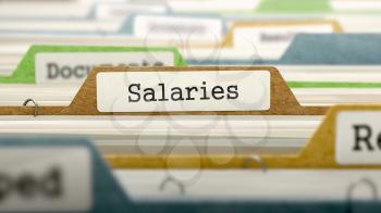 Salaries on Business Folder in Multicolor Card Index. Closeup View. Blurred Image.