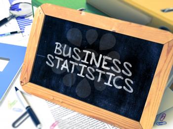 Hand Drawn Business Statistics Concept  on Chalkboard. Blurred Background. Toned Image.