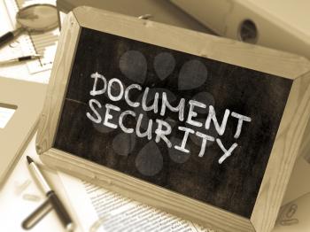 Document Security Handwritten by White Chalk on a Blackboard. Composition with Small Chalkboard on Background of Working Table with Office Folders, Stationery, Reports. Blurred, Toned 3d Illustration.