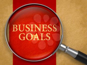 Business Goals through Magnifying Glass on Old Paper with Crimson Vertical Line Background. 3d Render.