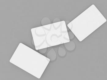 Three white business cards mock up on a gray background. 3d render illustration.