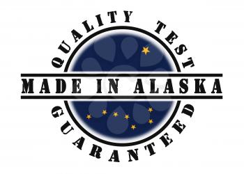 Quality test guaranteed stamp with a state flag inside, Alaska