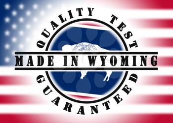 Quality test guaranteed stamp with a state flag inside, Wyoming