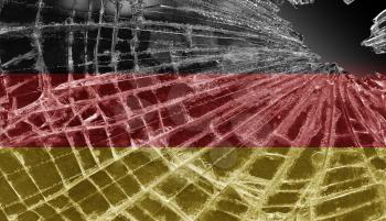 Broken ice or glass with a flag pattern, isolated, Germany