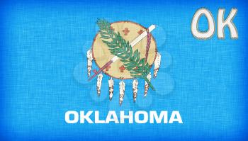 Linen flag of the US state of Oklahoma with it's abbreviation stitched on it