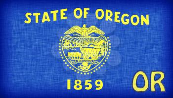 Linen flag of the US state of Oregon with it's abbreviation stitched on it