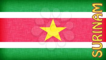 Linen flag of Suriname with letters stitched on it