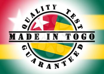 Quality test guaranteed stamp with a national flag inside, Togo