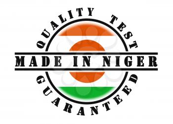 Quality test guaranteed stamp with a national flag inside, Niger