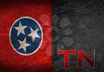 Old rusty metal sign with a flag and state abbreviation - Tennessee