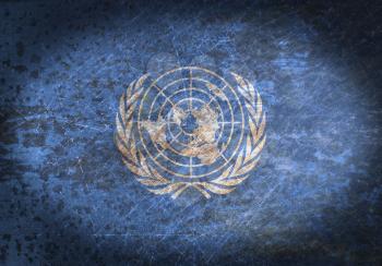 Old rusty metal sign with a flag - United Nations
