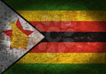 Old rusty metal sign with a flag - Zimbabwe