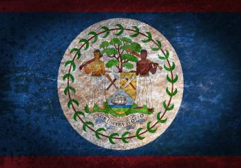 Old rusty metal sign with a flag - Belize
