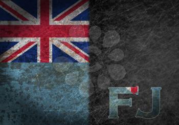 Old rusty metal sign with a flag and country abbreviation - Fiji
