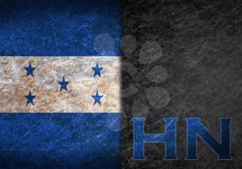Old rusty metal sign with a flag and country abbreviation - Honduras