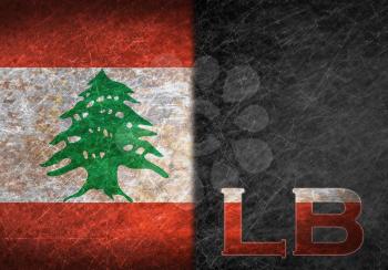 Old rusty metal sign with a flag and country abbreviation - Lebanon