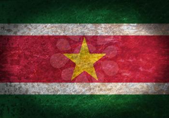 Old rusty metal sign with a flag - Suriname