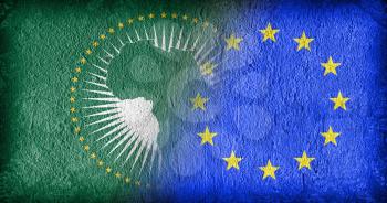 The African Union and the EU, flags painted on cracked concrete