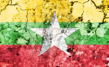 Old cracked wall with painted flag, flag of Myanmar