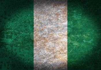 Old rusty metal sign with a flag - Nigeria