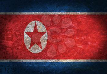 Old rusty metal sign with a flag - North Korea