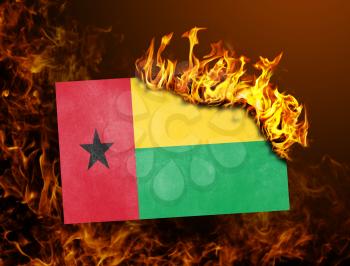 Flag burning - concept of war or crisis - Guinea Bissau