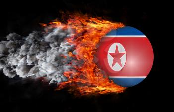 Concept of speed - Flag with a trail of fire and smoke - North Korea