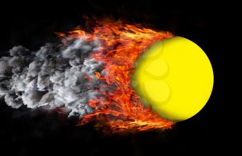 Concept of speed - Ball with a trail of fire and smoke - yellow