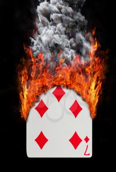 Playing card with fire and smoke, isolated on white - Seven of diamonds