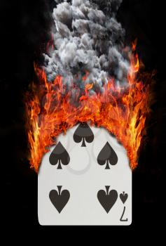 Playing card with fire and smoke, isolated on white - Seven of spades