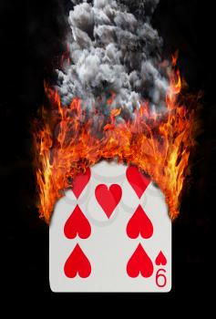 Playing card with fire and smoke, isolated on white - Nine of hearts