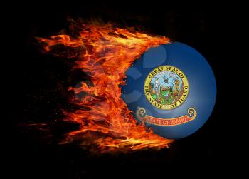 Concept of speed - US state flag with a trail of fire - Idaho