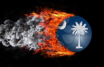 Concept of speed - Flag with a trail of fire and smoke - South Carolina