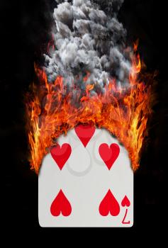Playing card with fire and smoke, isolated on white - Seven of hearts