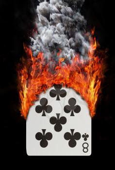 Playing card with fire and smoke, isolated on white - Eight of clubs