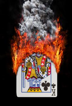 Playing card with fire and smoke, isolated on white - King of clubs