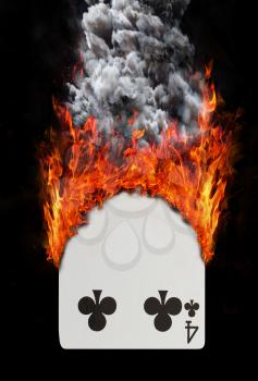 Playing card with fire and smoke, isolated on white - Four of clubs