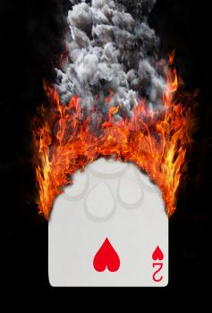 Playing card with fire and smoke, isolated on white - Two of hearts