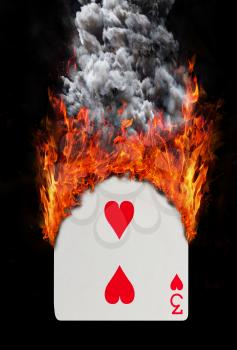 Playing card with fire and smoke, isolated on white - Three of hearts
