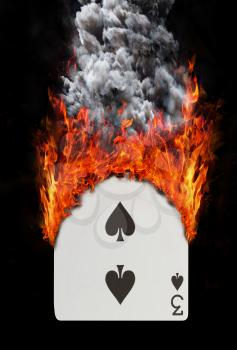 Playing card with fire and smoke, isolated on white - Three of spades