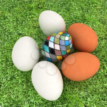 Eggs and easter eggs and grass
