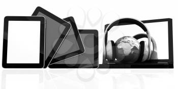 headphones and  earth on the  laptop and tablet pc on a white background