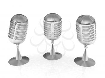 3 metal microphones on a white background