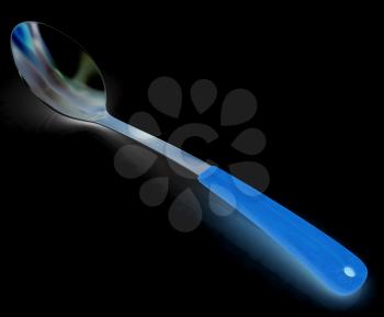Long spoon on a black background