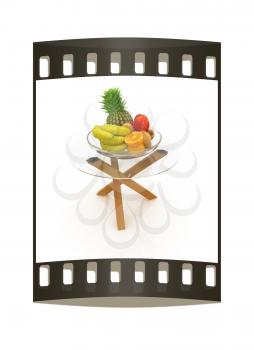 Citrus in a glass dish on exotic glass table with wooden legs on a white background. The film strip