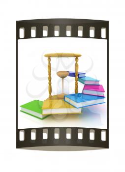 Hourglass and books on a white background. The film strip