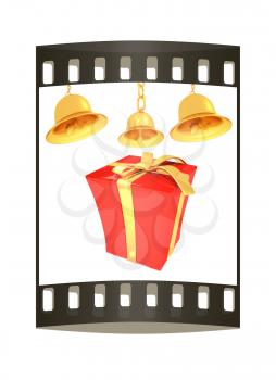 Gold bell and red gift box with golden ribbon on white background. The film strip